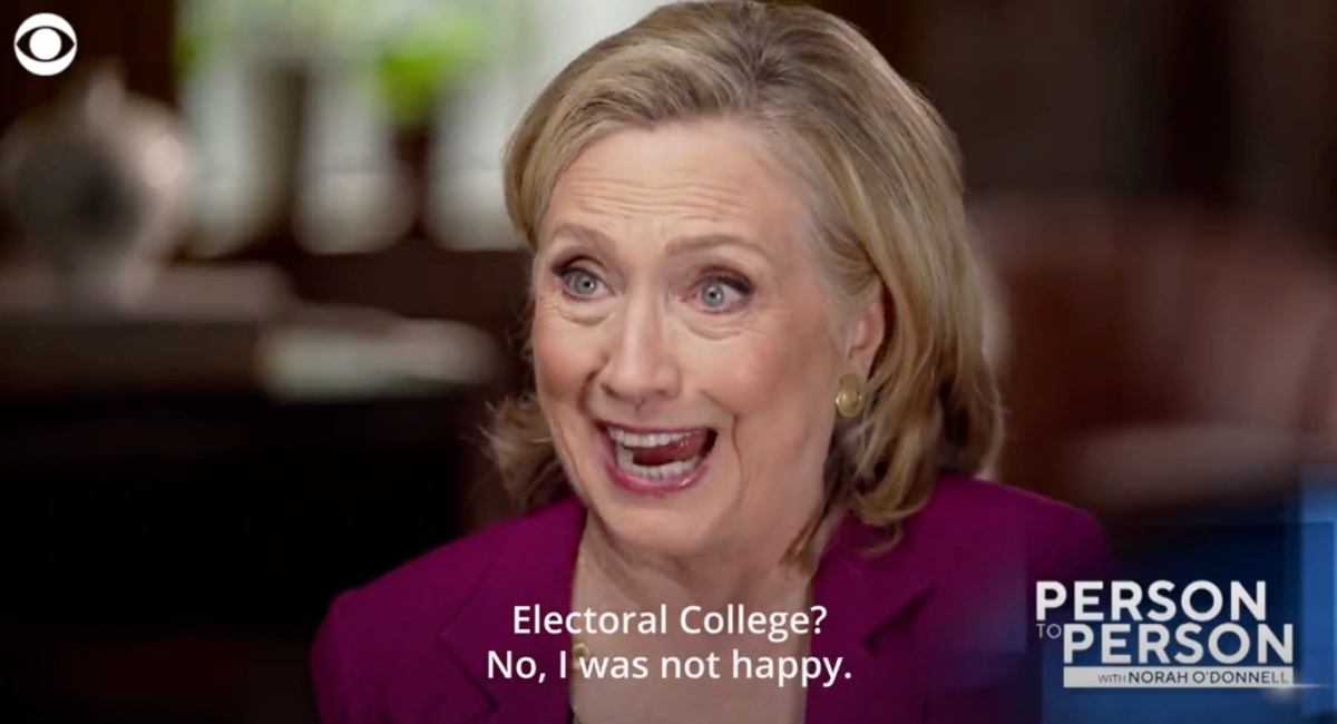 Hillary Clinton speaking with the words "Electoral college? No I was not happy"