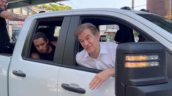 Dr. Oz in a pickup truck with addicts