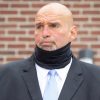 Fetterman wearing a neck gaiter that happens to hide his neck bulge