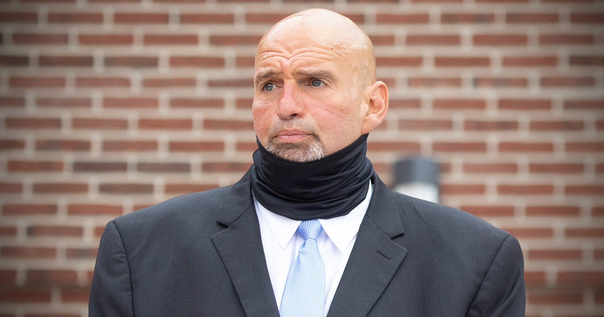 Fetterman wearing a neck gaiter that happens to hide his neck bulge