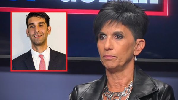 Gina Perna with a photo of her nephew Matthew Perna wearing a suit