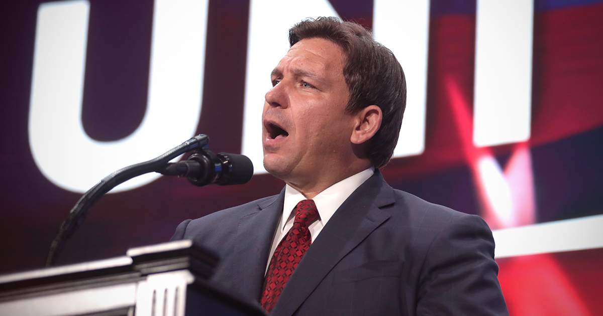 Ron DeSantis speaks on a stage