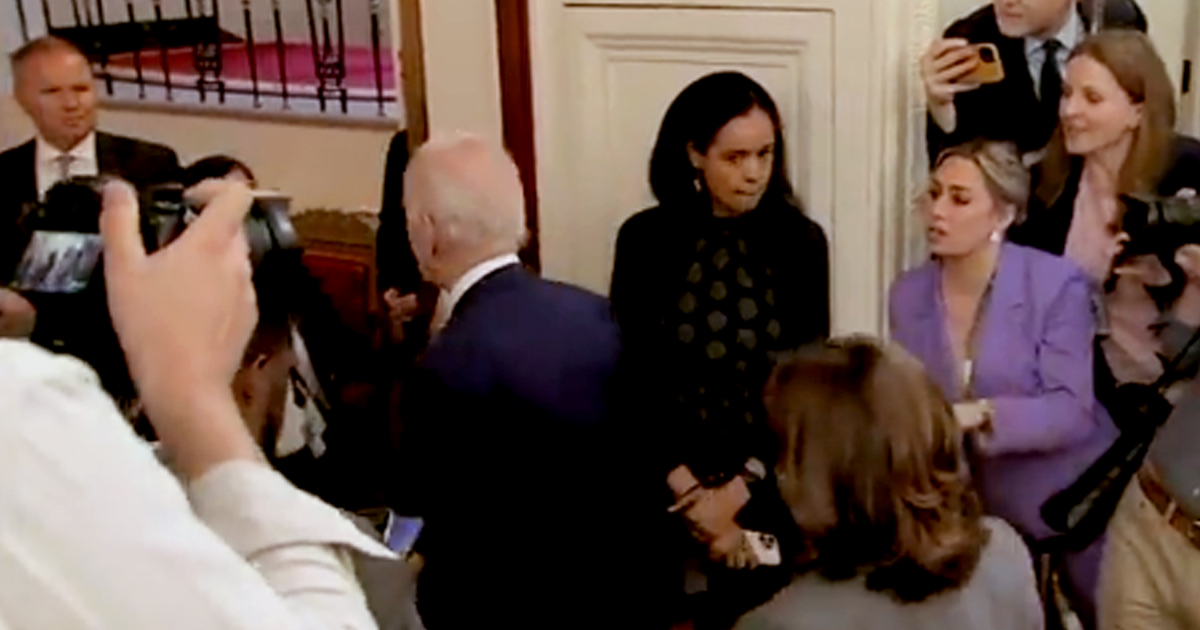 Joe Biden surrounded by reporters