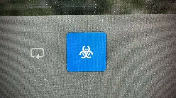 Bioweapon Defense Mode emblem activated on a Tesla dashboard