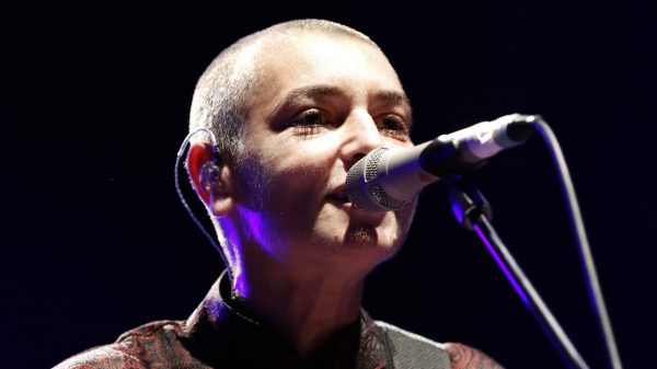 Sinead O'Connor singing into a microphone