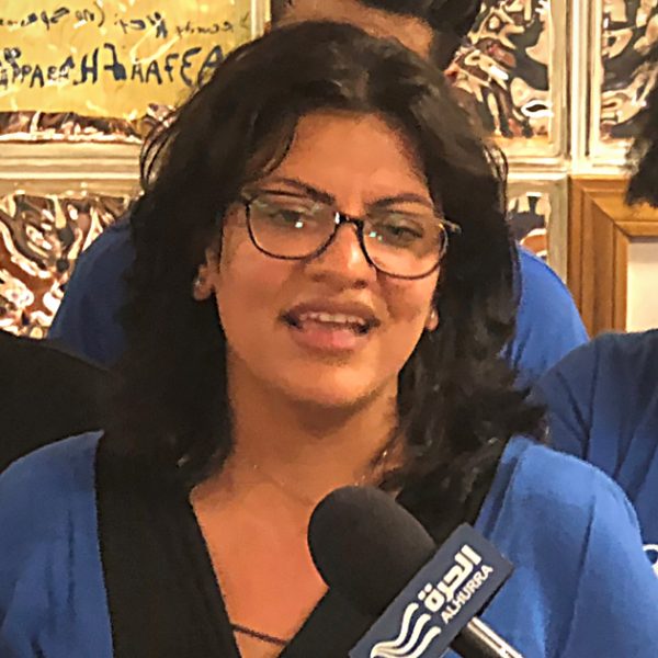 Rashida Tlaib stands with supporters