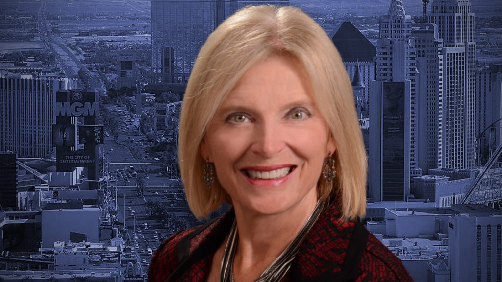 Headshot of Heidi Kasama with Las Vegas skyline in the background