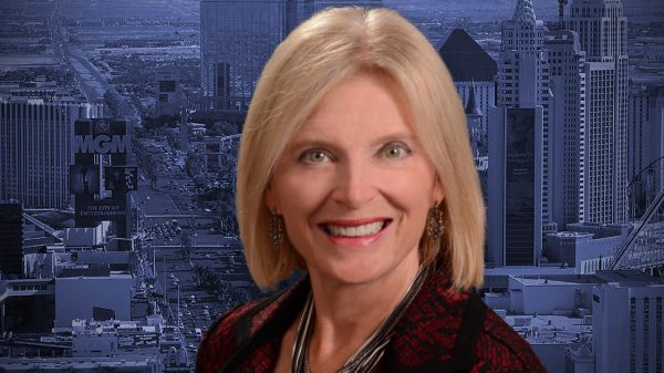 Headshot of Heidi Kasama with Las Vegas skyline in the background