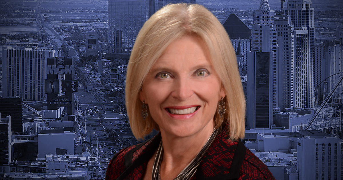 Headshot of Heidi Kasama with Las Vegas skyline in the background